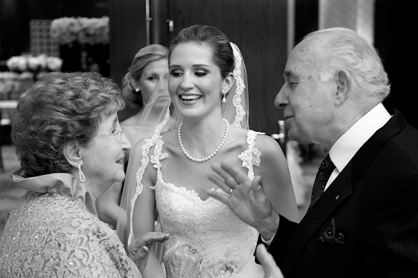 the bride talking talking with parents - photo by Houston based wedding photographer Adam Nyholt